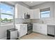 Modern kitchen with white shaker cabinets and stainless steel appliances at 2430 6Th N Ave, St Petersburg, FL 33713