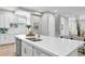 Modern kitchen island with white cabinets and quartz countertops at 2430 6Th N Ave, St Petersburg, FL 33713