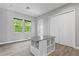 Versatile room with built-in storage and wood-look floors at 2430 6Th N Ave, St Petersburg, FL 33713