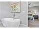 Elegant bathroom with a free-standing tub and a view of the bedroom at 2430 6Th N Ave, St Petersburg, FL 33713