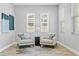 Cozy sitting area with two armchairs and a stylish rug at 2430 6Th N Ave, St Petersburg, FL 33713