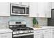 Stainless steel range and microwave in a modern kitchen at 2430 6Th N Ave, St Petersburg, FL 33713