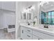 Modern bathroom with double vanity and a view of another room at 2430 6Th N Ave, St Petersburg, FL 33713