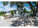 Bright exterior with a newly paved driveway at 104 11Th S Ave, Safety Harbor, FL 34695