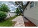 Backyard with patio, landscaping and white fence at 104 11Th S Ave, Safety Harbor, FL 34695