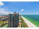 Aerial view of condo building and beach on a sunny day at 1540 Gulf Blvd # 2102, Clearwater Beach, FL 33767