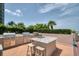 Outdoor grilling area with stainless steel grills and prep space at 1540 Gulf Blvd # 2102, Clearwater Beach, FL 33767