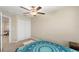 Spacious bedroom with ceiling fan and double door closet at 7203 Sweet Alyssum Ct, Tampa, FL 33619