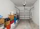 Attached garage with overhead door and ample storage space at 7203 Sweet Alyssum Ct, Tampa, FL 33619