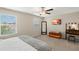 Bedroom with king bed, vanity, and ceiling fan at 7203 Sweet Alyssum Ct, Tampa, FL 33619