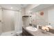 Bathroom with shower, vanity, and granite countertop at 7203 Sweet Alyssum Ct, Tampa, FL 33619