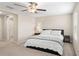 King bedroom with ceiling fan and en-suite bathroom at 7203 Sweet Alyssum Ct, Tampa, FL 33619