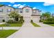 Front view of two-story townhome with gray siding and a two-car garage at 7203 Sweet Alyssum Ct, Tampa, FL 33619