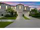 Two-story home with two-car garage and landscaping at 7203 Sweet Alyssum Ct, Tampa, FL 33619