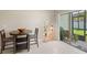 Bright breakfast nook features a table with chairs and access to a patio at 7203 Sweet Alyssum Ct, Tampa, FL 33619