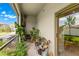Relaxing screened patio with lush plants and plenty of seating at 7203 Sweet Alyssum Ct, Tampa, FL 33619