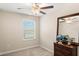 Bedroom with ceiling fan and dresser at 7203 Sweet Alyssum Ct, Tampa, FL 33619