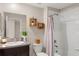 Clean bathroom with shower/tub combo and updated vanity at 7203 Sweet Alyssum Ct, Tampa, FL 33619