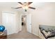 Bedroom with large closet and access to upstairs hallway at 7203 Sweet Alyssum Ct, Tampa, FL 33619