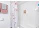 Clean bathroom with shower stall and flamingo shower curtain at 6400 46Th N Ave # 117, Kenneth City, FL 33709