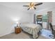 Bedroom with ceiling fan and window coverings at 6400 46Th N Ave # 117, Kenneth City, FL 33709