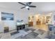 Living room with gray sofa, TV, and a view of the dining area at 6400 46Th N Ave # 117, Kenneth City, FL 33709