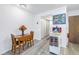 Bright dining area with wood table and chairs at 6400 46Th N Ave # 117, Kenneth City, FL 33709