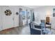 Living room with gray reclining sofa, wicker chairs, and gray flooring at 6400 46Th N Ave # 117, Kenneth City, FL 33709