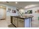 Kitchen island with granite countertop and sink at 2313 Sunset Wind Loop, Oldsmar, FL 34677