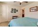 Bedroom with a teal comforter and access to another room at 2313 Sunset Wind Loop, Oldsmar, FL 34677