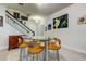 Bright dining area with glass table and four chairs at 2313 Sunset Wind Loop, Oldsmar, FL 34677