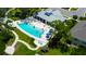 Community pool with surrounding landscaping and cabana at 2313 Sunset Wind Loop, Oldsmar, FL 34677