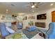 Open concept living room and kitchen with comfortable seating and a large TV at 2313 Sunset Wind Loop, Oldsmar, FL 34677