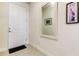 Light and bright entryway with mirror at 2313 Sunset Wind Loop, Oldsmar, FL 34677
