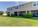 Townhouse with screened porch and grassy backyard at 2313 Sunset Wind Loop, Oldsmar, FL 34677
