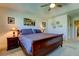 Main bedroom with a king-size bed and en-suite bathroom at 2313 Sunset Wind Loop, Oldsmar, FL 34677