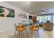 Casual dining area with glass top table and wood chairs at 2313 Sunset Wind Loop, Oldsmar, FL 34677