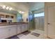Bathroom with double vanity and large walk-in shower at 2313 Sunset Wind Loop, Oldsmar, FL 34677