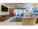 Spacious living room boasts ample natural light and comfortable seating at 2313 Sunset Wind Loop, Oldsmar, FL 34677