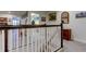 Upstairs hall with railing and access to laundry and bedrooms at 2313 Sunset Wind Loop, Oldsmar, FL 34677