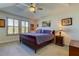 Main bedroom with a king-size bed and ceiling fan at 2313 Sunset Wind Loop, Oldsmar, FL 34677
