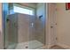 Large walk-in shower with neutral tile and glass enclosure at 2313 Sunset Wind Loop, Oldsmar, FL 34677