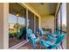 Covered patio with seating area and view of the backyard at 2313 Sunset Wind Loop, Oldsmar, FL 34677
