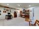 Spacious home office with built-in shelving and hardwood floors at 2313 Sunset Wind Loop, Oldsmar, FL 34677