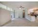 Spacious living room with light wood flooring and large windows at 161 Overbrook W St, Largo, FL 33770