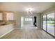 Open dining area with a view of the living room and pool at 161 Overbrook W St, Largo, FL 33770