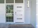 Modern front door with glass panels and sleek design at 161 Overbrook W St, Largo, FL 33770