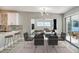 Modern dining room with glass table and access to patio at 161 Overbrook W St, Largo, FL 33770