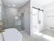 Luxurious bathroom with a soaking tub, walk-in shower, and modern fixtures at 161 Overbrook W St, Largo, FL 33770