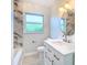 Modern bathroom with white vanity, hexagon tile, and new fixtures at 161 Overbrook W St, Largo, FL 33770